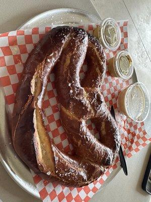 Pretzel with queso and mustard