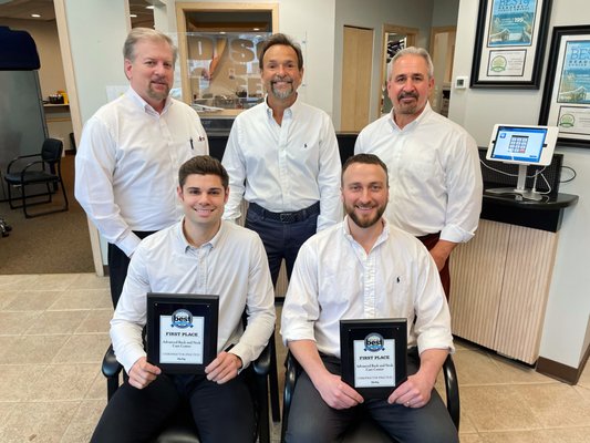 Our Chiropractic doctors holding up our "Best of the Best" plaques. We have been voted best chiropractic office 7 years in a row!