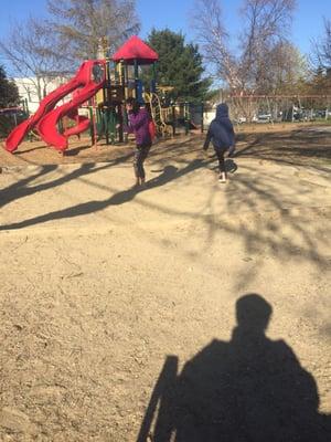 They have a park bench, a sand box and a red Playground!