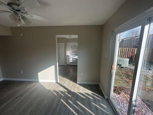 Dining Room paint, LVP floors, and trim with entryway into kitchen refreshed.