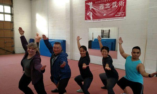 Coach Jeannette and Guest Coach Mark Moran visit Sifu Li at Northwest Wushu in Seattle. Also pictured are Hansee and Michael.