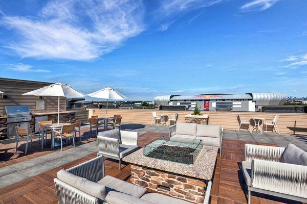 Rooftop grills, fire pits, and lounge seating with views of Red Bull Arena