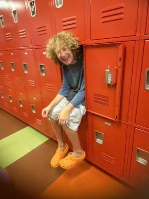 very happy boy in locker