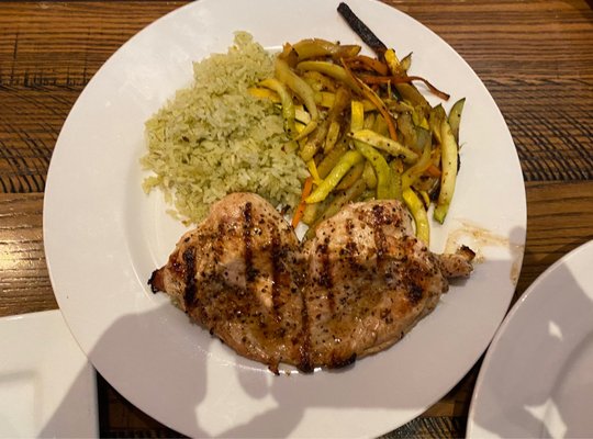 Fired roasted chicken breast with rice and zucchini