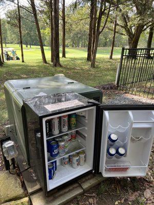 the '14th hole, home stretch' A homeowner provided fridge with cold beverages, mostly Bud Light' you're on the honor system