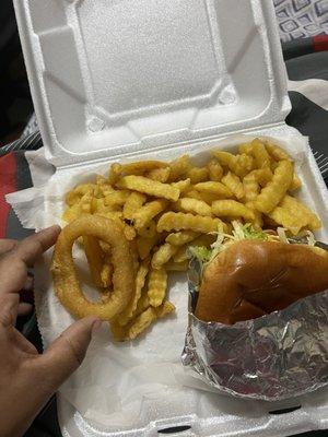 Cheeseburger n fries with one of my onion rings from my side order of onion rings