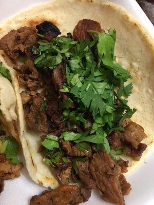 Carne Asada taco $1.50 I put cilantro. It comes plain