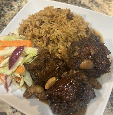 Jamaican style oxtails , rice and beans and cabbage and carrots salad!