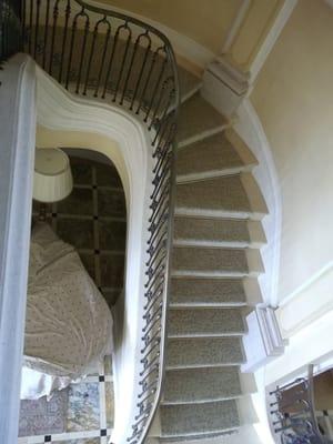 Custom stairway installed over a marble staircase.