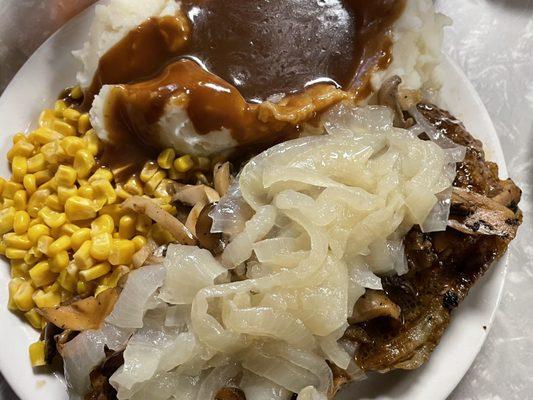 Steak topped with onions & mushrooms, corn, and mashed potatoes with gravy