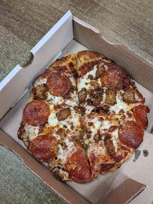 Meat lovers pizza. Hot and tasty. $8.80 and you can add a drink for $1.20.