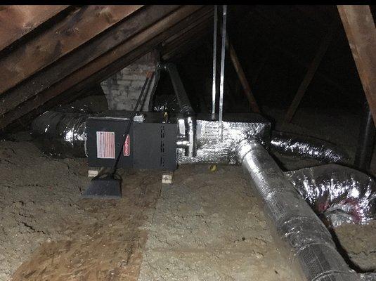 Attic gas-fired furnace and insulated ductwork; heating and AC capability