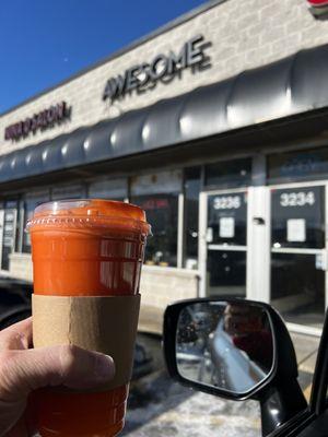 Large carrot, apple, orange mixed in a centrifugal juicer. It was AWESOME.