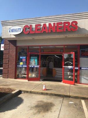 Outside of dry cleaners attached to a Chevron gas station