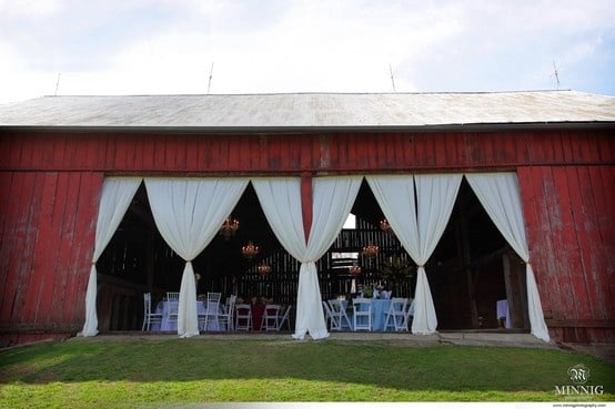 Outside of the barn with the doors open as far as they go.