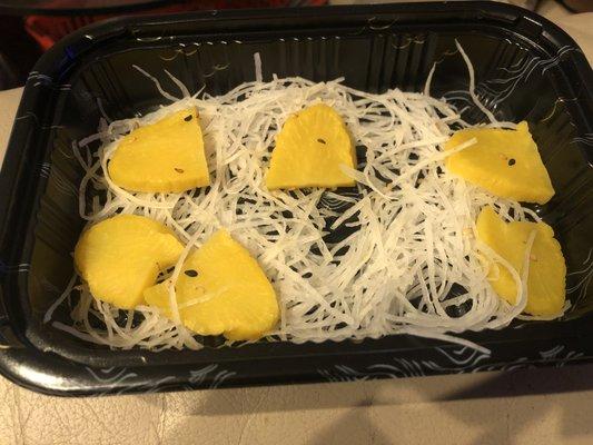 7-8 meager slices of daikon sold for $7 as "Oshinko ASSORTED pickles"