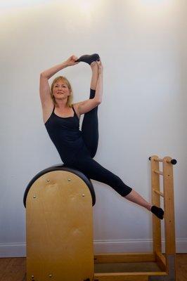 June Hines in side sit ups on the Ladder Barrel