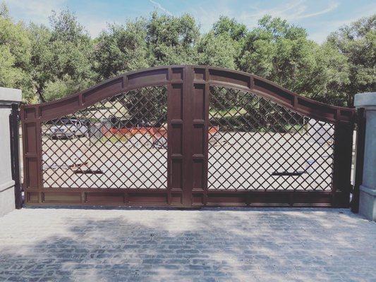 Another beautiful custom designed entry gate with gorgeous bronze vein powder coated finish. Big bold gate for a big bold property!