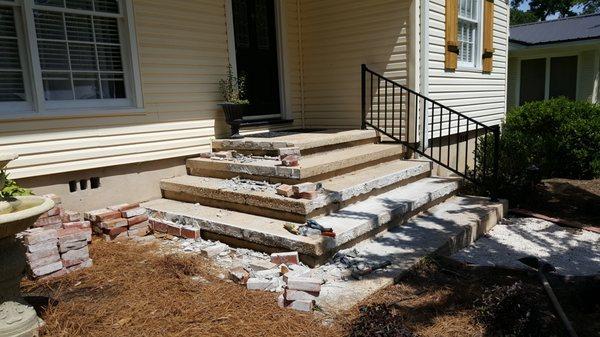 Concrete and brick steps remodel. Removal of existing brick.