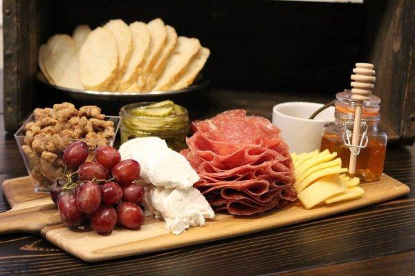 "The Piglet" - Small Board Serves 2-4 people; Includes: 2 cheeses, 1 meat, homemade pickles, candied nuts, and choice of 2 homemade sides.