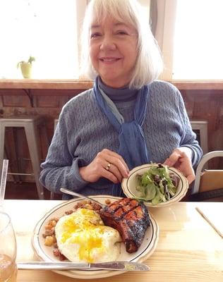 Helen shows off the pork and egg breakfast special.