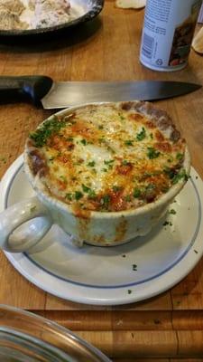 French onion soup topped with toasted cheese.