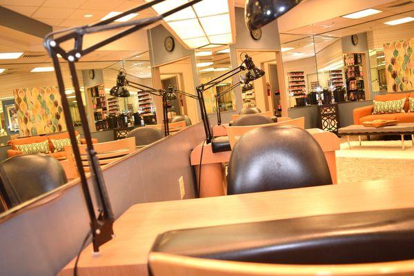 Luxurious Richland Mall manicure chairs at Belk Salon & Spa, the best salon in Columbia, SC with salon products by Redken & Phyto.