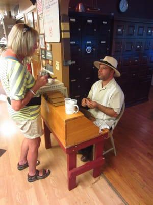 Our on staff professional cigar blender & roller Don Francisco Padilla rolling in the store. He was with Arturo Fuente for 13 years.