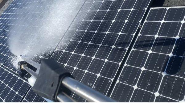 Biodegradable soap gently sprayed on solar panels