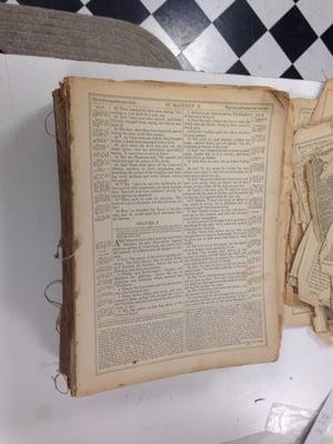 Before Advantage repaired this 1800's bible, this was its condition. All it had was a detached front cover.