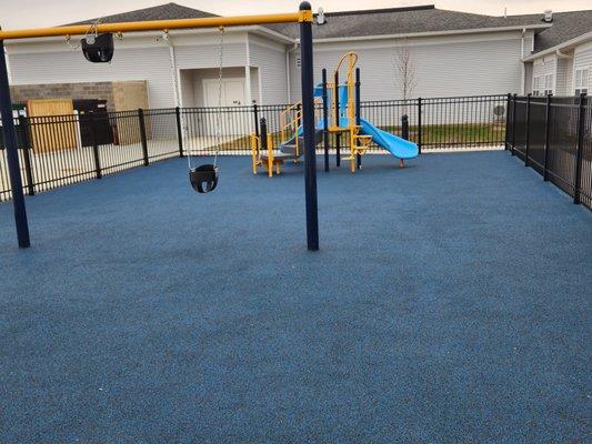 The outdoor play area for the kids in the preschool.