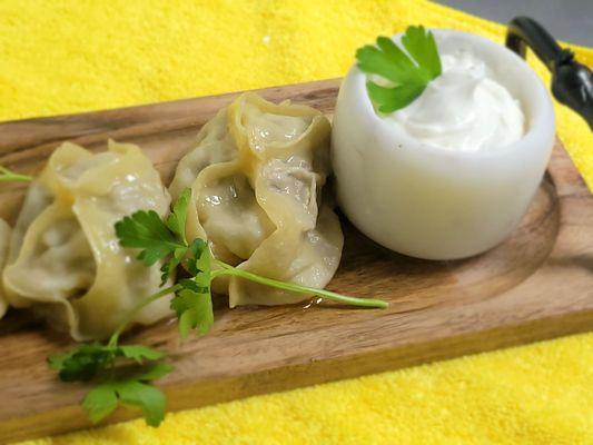 Uzbekistan signature dish. Manti  Fresh dough, stuffed with onions, herb, meat, or squash