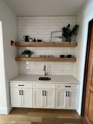 Remodeled the clubhouse with custom cabinets and backsplash with floating shelves