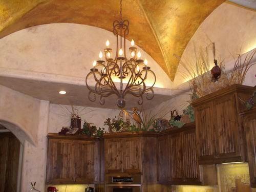 A beautiful coppery metallic ceiling tops these hand-troweled and glazed Tuscan walls.