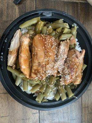 Teriyaki bowl with what seems to be overcooked canned green beans and overcooked Minute Rice. $9