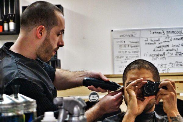 Client gives barber freshcut on the late night