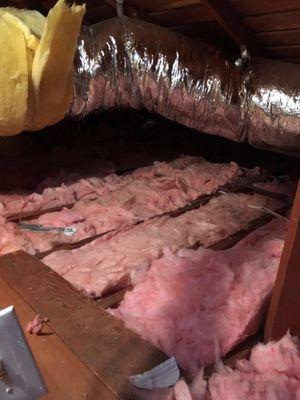 Old attic insulation cleaned out and installation of new R30 batts insulation