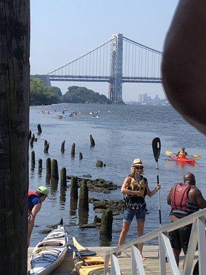 Boarding dock with 1st wave of kayakers coming back in the distance.