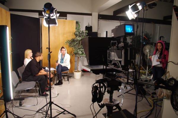 Students preparing to broadcast a talk show.