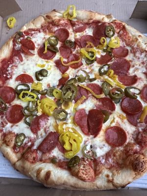 Pepperoni pizza with jalapeños and banana peppers