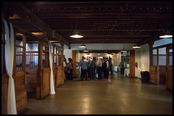 View from back of barn, guest in line at the bar