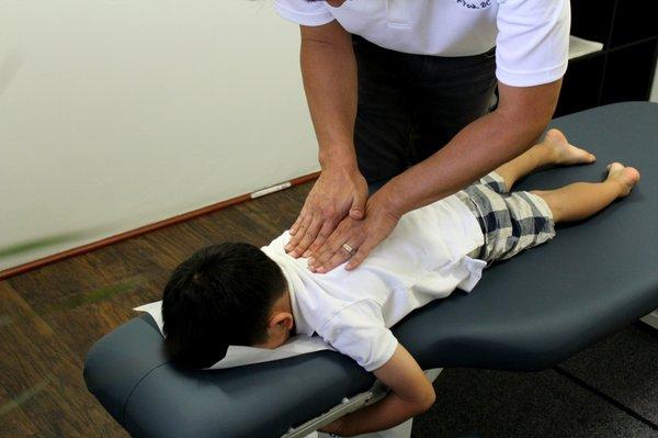 Spinal manipulation for kid, make them straighter and taller...