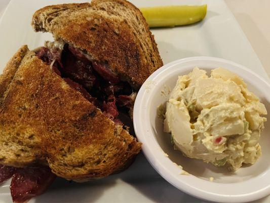 Sunset Sailor Sandwich (pastrami, knockwurst, & Swiss cheese) with Potato Salad ($12.95).