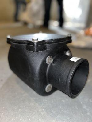 Standard 4" cast iron no-hub check valve.