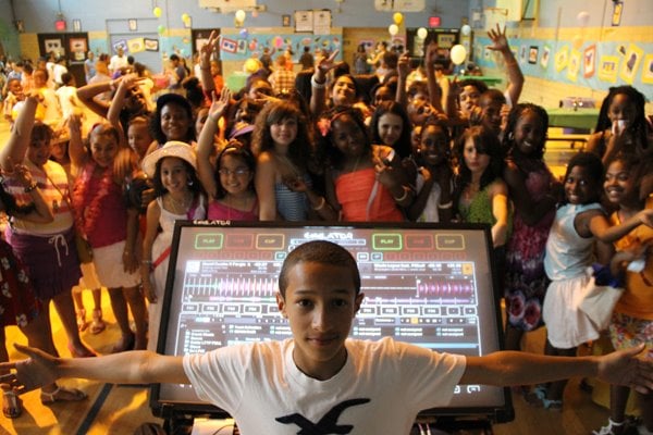 Devan Ibiza performing at the annual school dance for the kids at his former elementary school.