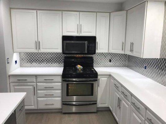 Kitchen remodel. Design, hardwood flooring, counter top, back splash, island and cupboard installation by Urban Floors.