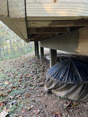 Underside of porch that needed to be widened and stabilized