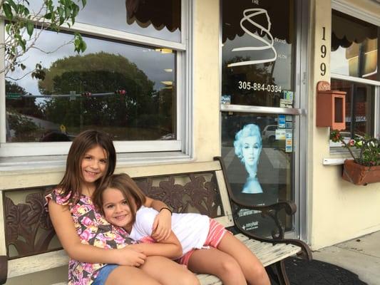 Girls showing off their new haircuts at The Strand Salon.