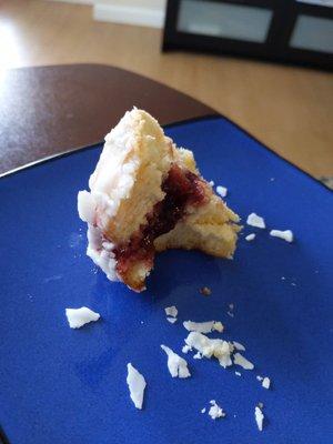 So tasty! A glazed Raspberry paczki that's almost all gone.