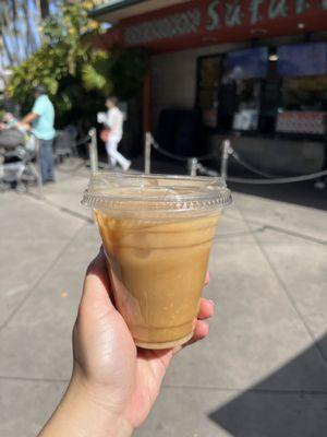 Small iced vanilla latte with oat milk